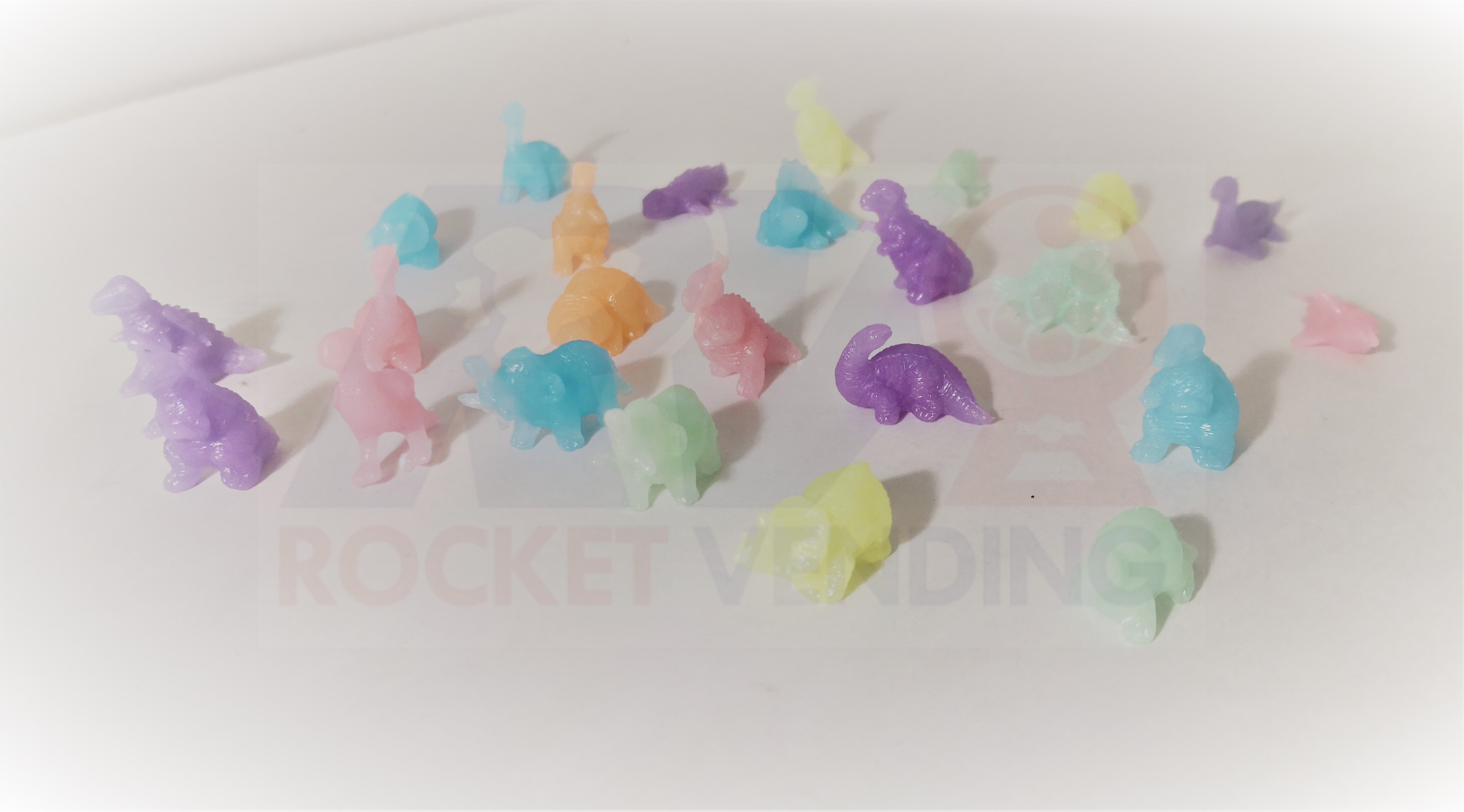 100 mini dinosaurios Brillan en la oscuridad encapsulados 1 pulgada js - Rocket Vending Todo en Chicleras