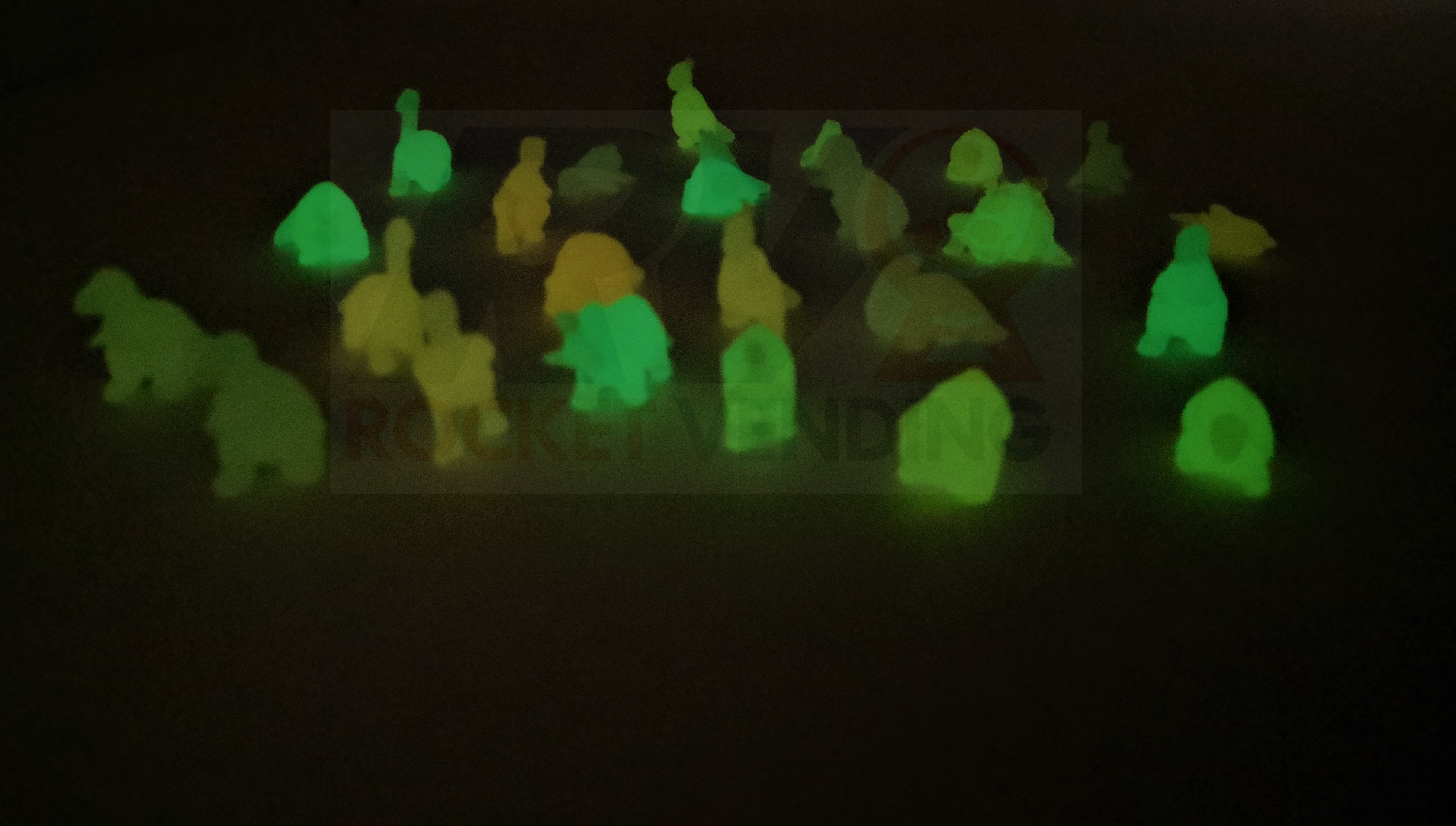 100 mini dinosaurios Brillan en la oscuridad encapsulados 1 pulgada js - Rocket Vending Todo en Chicleras